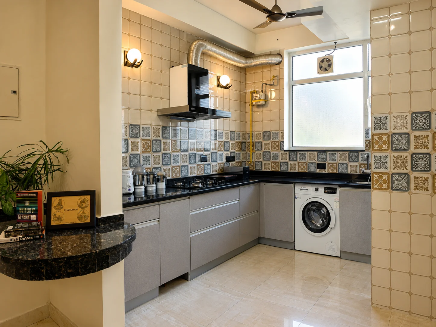 Modern clean kitchen cabinets and counter spaces at the best homestay in Dehradun